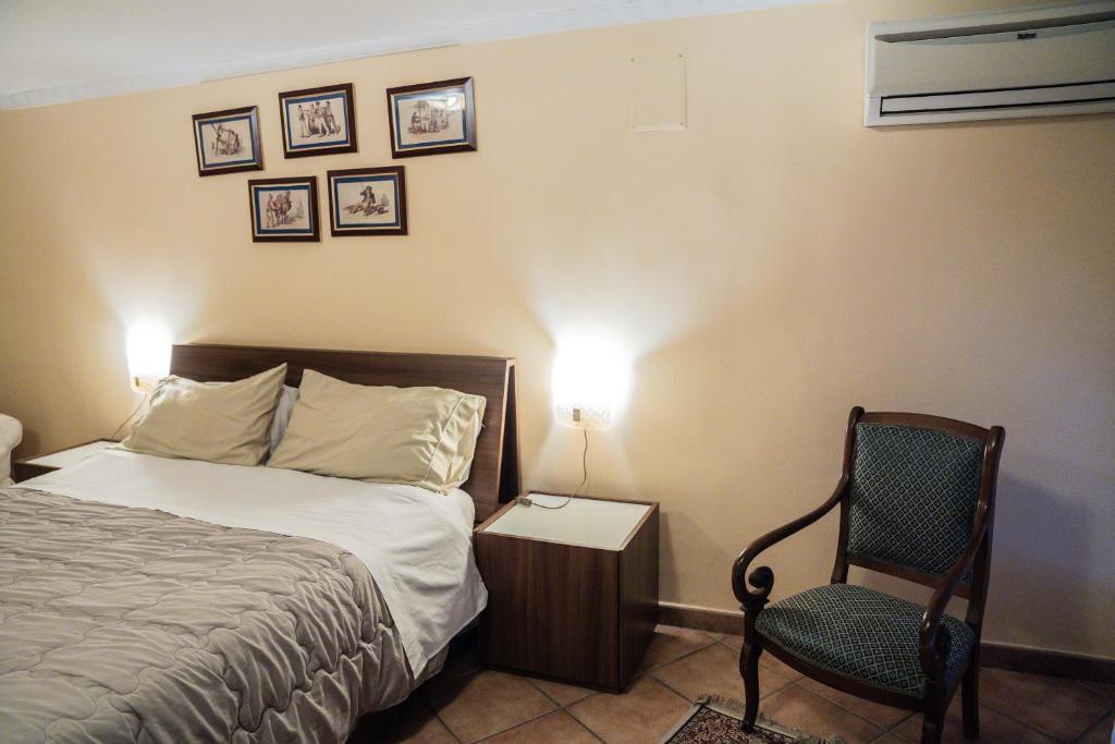 A bed or beds in a room at Domus Ugo