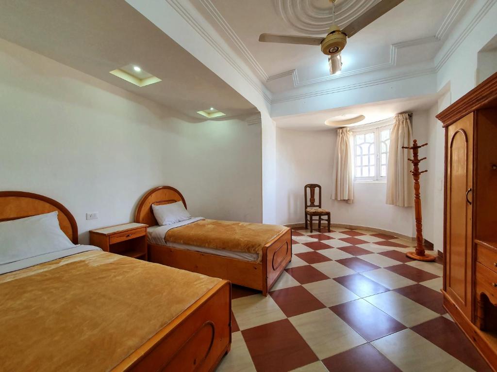 Postel nebo postele na pokoji v ubytování Spring Hotel Luxor