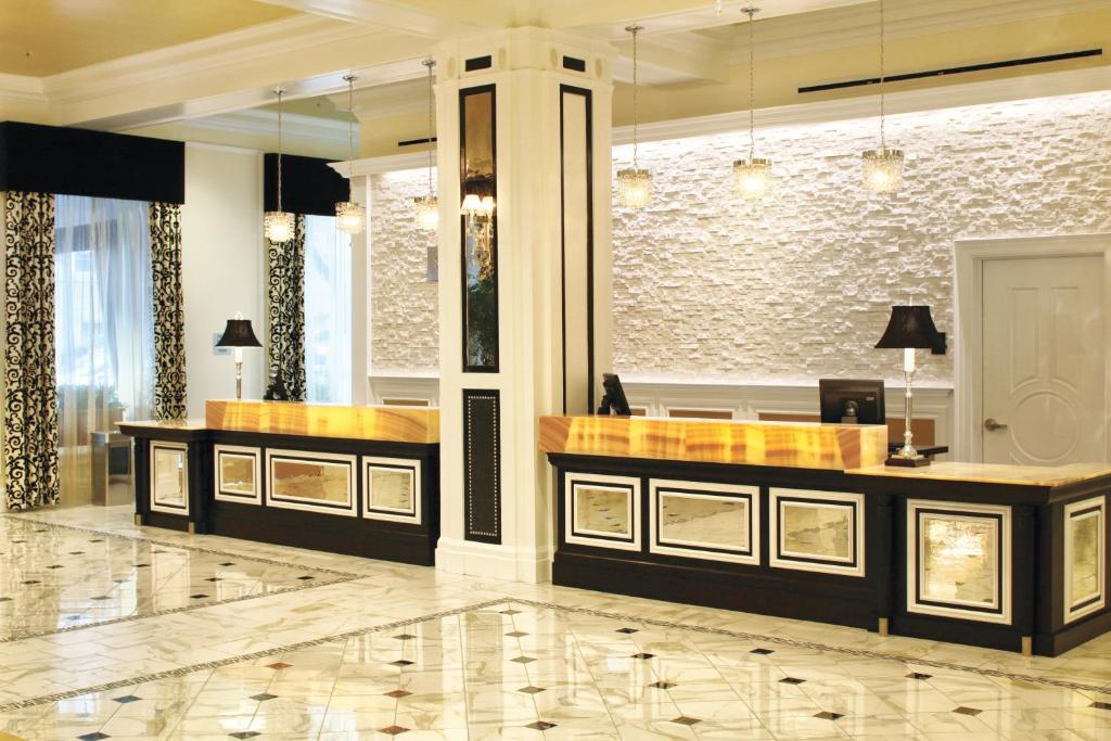 a lobby with a reception desk in a building at Club Wyndham Canterbury in San Francisco