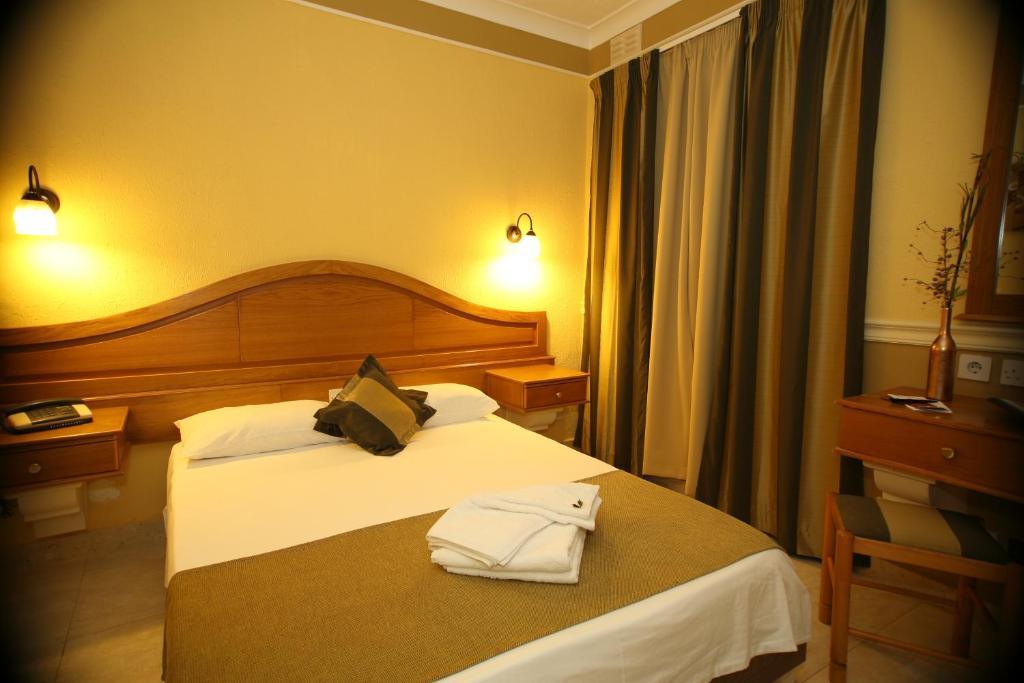 Postel nebo postele na pokoji v ubytování Soreda Hotel