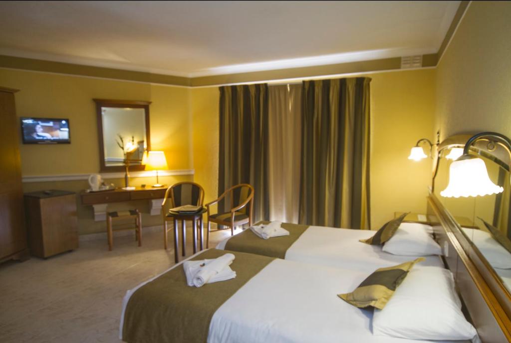Postel nebo postele na pokoji v ubytování Soreda Hotel