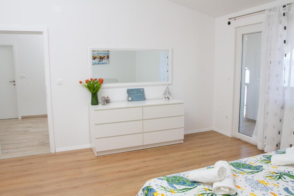 Posteľ alebo postele v izbe v ubytovaní Unforgettable sea view apartments Bakota