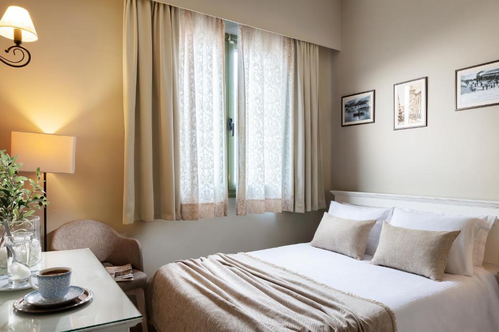 Postel nebo postele na pokoji v ubytování Tourist Boutique Hotel