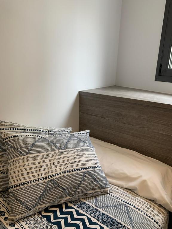 Posteľ alebo postele v izbe v ubytovaní Apartaments El Cine