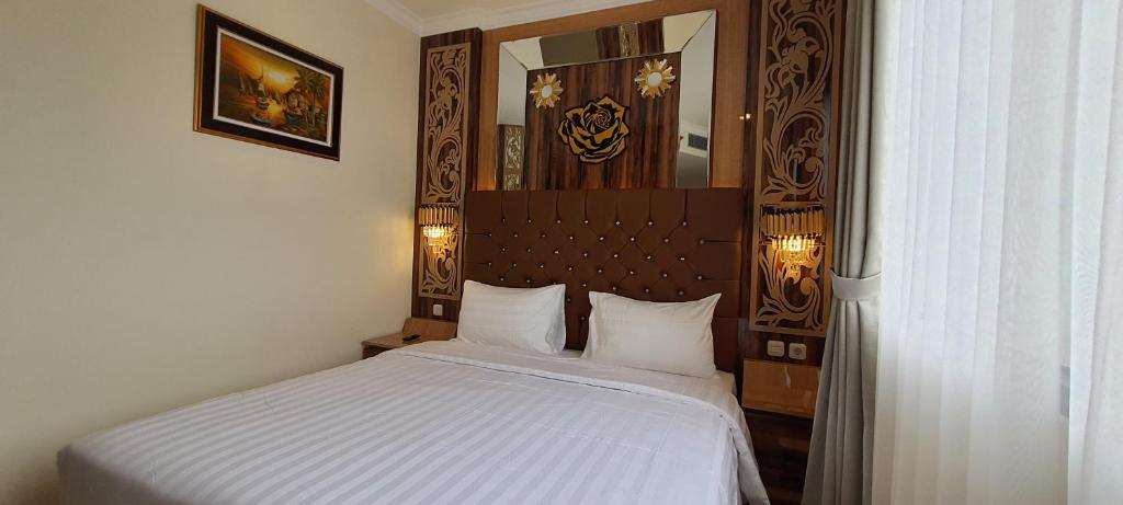 Postel nebo postele na pokoji v ubytování Hotel Daily Inn Bandung
