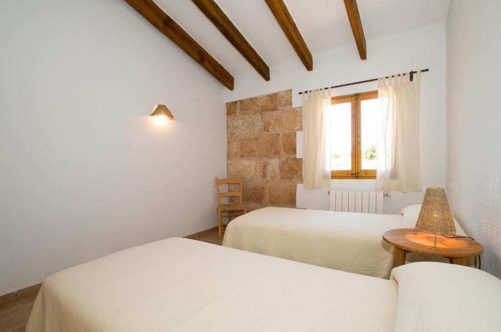 Postel nebo postele na pokoji v ubytování Finca Agroturismo Can Carro