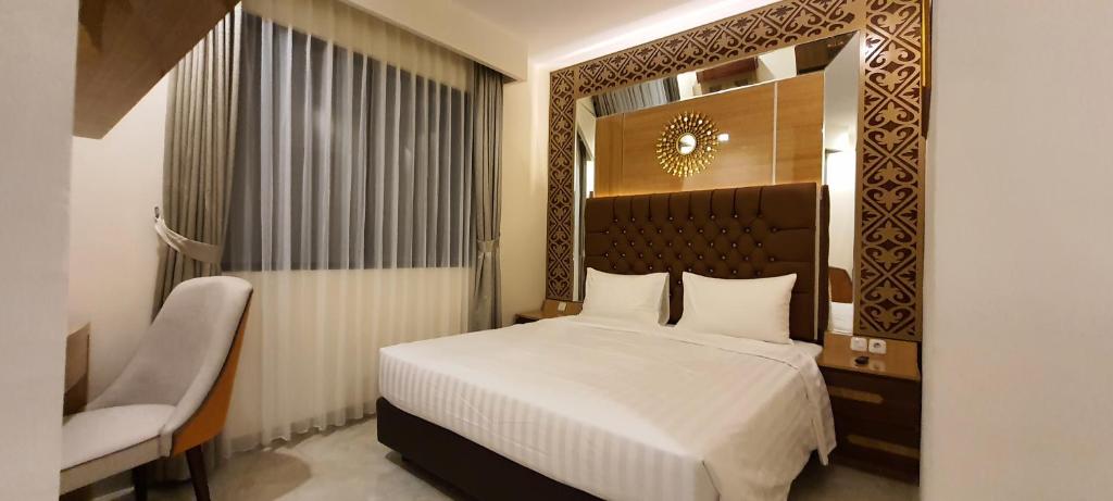 Postel nebo postele na pokoji v ubytování Hotel Daily Inn Bandung