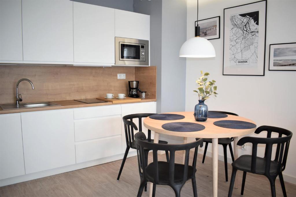 Kuchyňa alebo kuchynka v ubytovaní Apartos Apartamenty Grano Residence