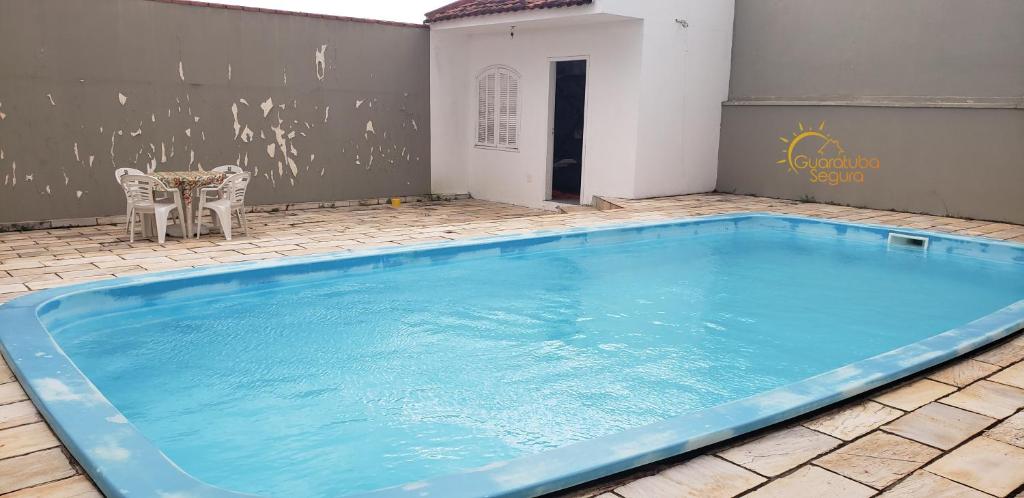  Casa de Veraneio com Piscina Guaratuba