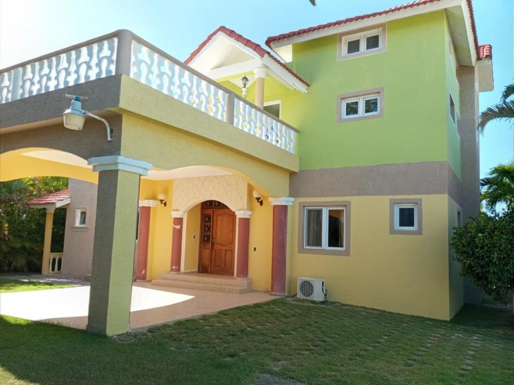a large house with a balcony on top of it at Villas Michaela Caribbean in Sosúa