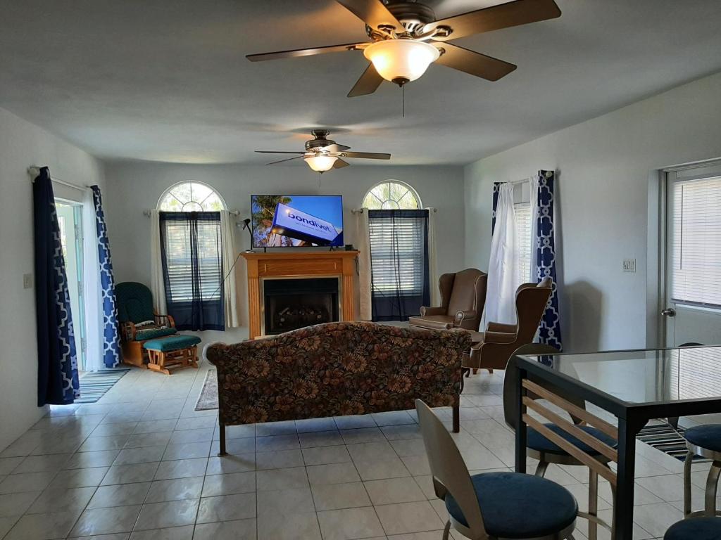 a living room with a couch and a tv at AIRBAB Moon Gate West in Mount Pleasant