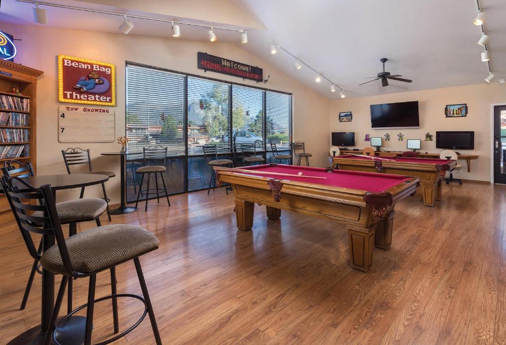 a billiard room with a pool table and two tables at Club Wyndham Flagstaff in Flagstaff