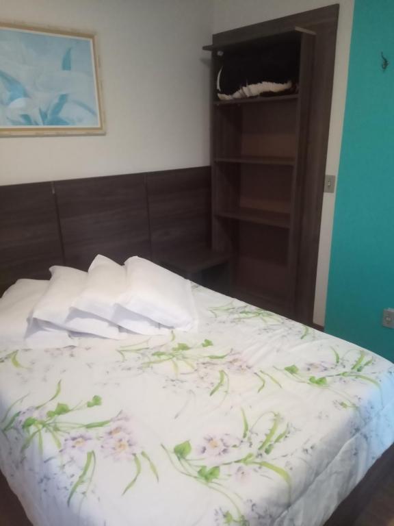 Postel nebo postele na pokoji v ubytování Residencial Aconchego do Lago