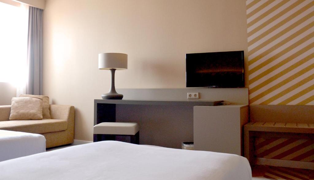 Postel nebo postele na pokoji v ubytování Hotel Do Colegio