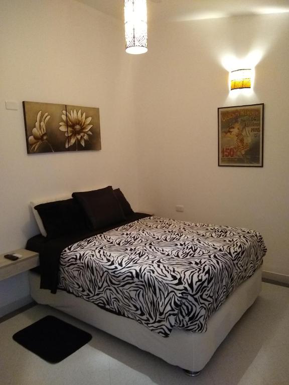 Postel nebo postele na pokoji v ubytování La Habitación Perfecta