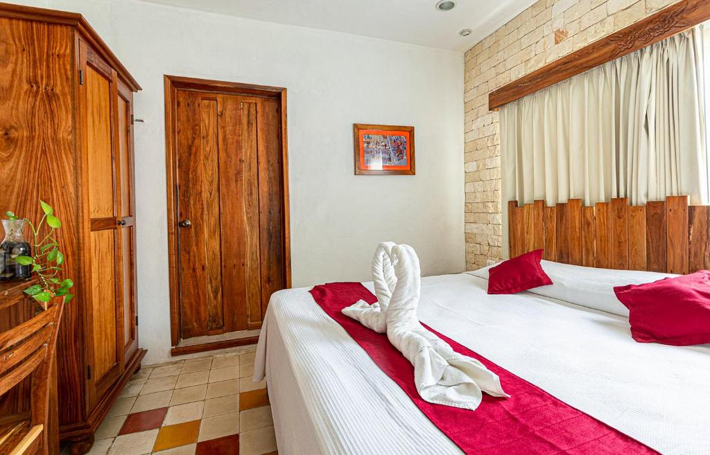 Postel nebo postele na pokoji v ubytování Hotel Boutique Casa Hipil