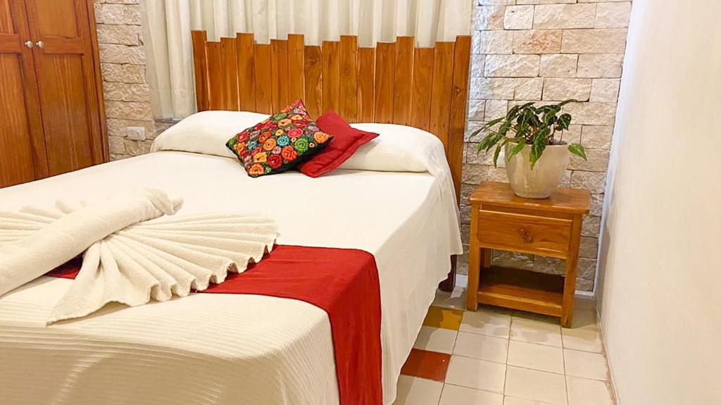 Postel nebo postele na pokoji v ubytování Hotel Boutique Casa Hipil