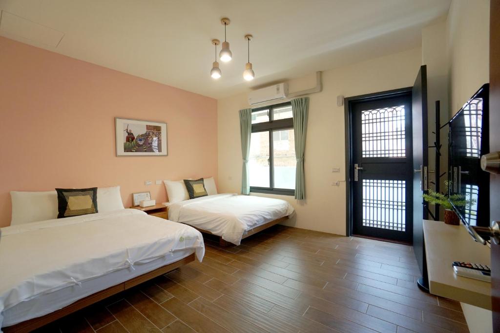 Voodi või voodid majutusasutuse Bo Bo Mi B&B toas