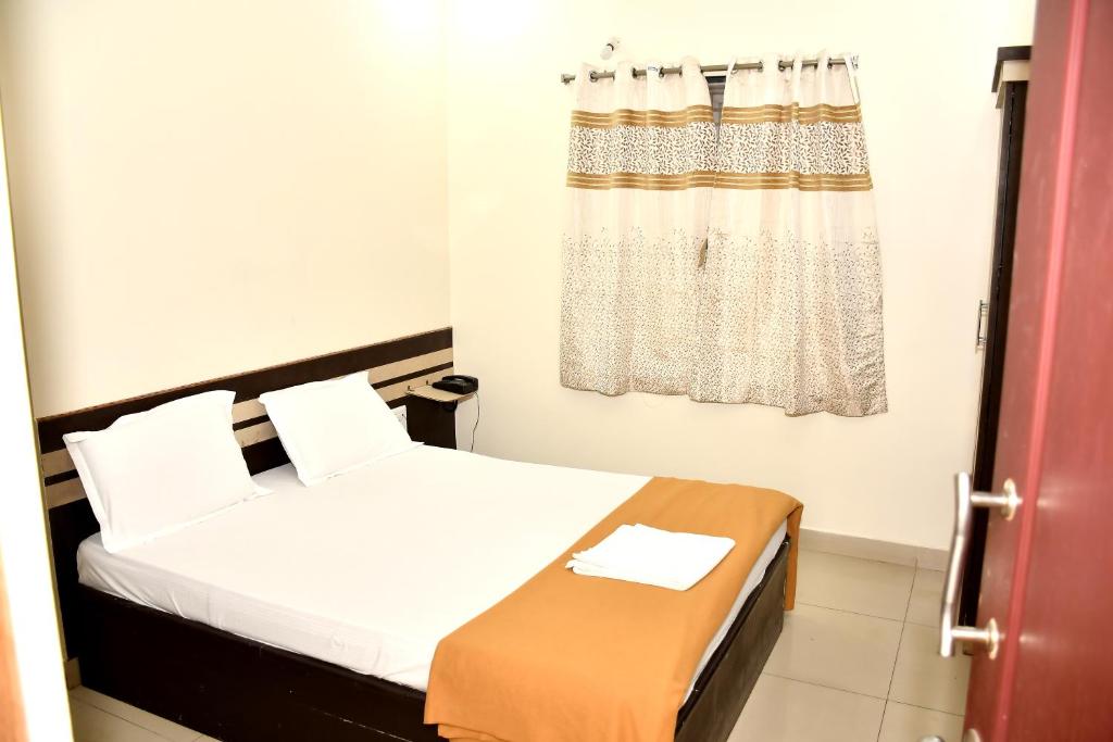 Postel nebo postele na pokoji v ubytování SSR Hotel