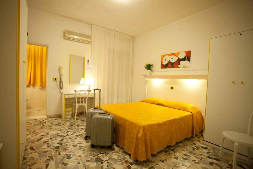 Postel nebo postele na pokoji v ubytování Hotel Medusa