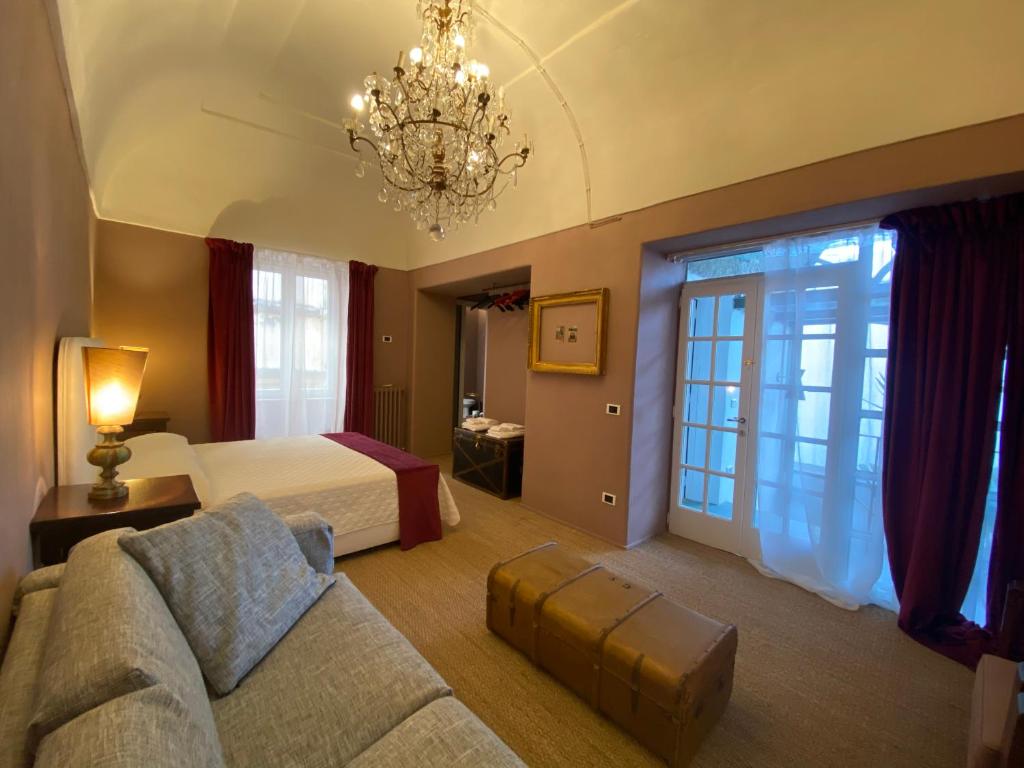 Postel nebo postele na pokoji v ubytování Suites Edivino Design Capri