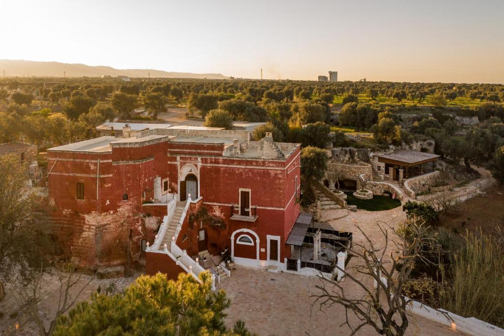 an aerial view of an old red brick building at Masseria Torre Rossa in Fasano