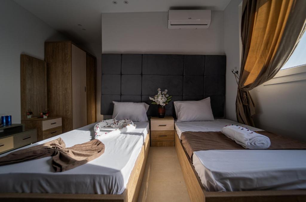 Postel nebo postele na pokoji v ubytování Gardenia Inn