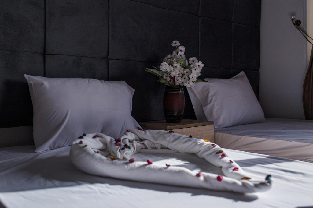 Postel nebo postele na pokoji v ubytování Gardenia Inn