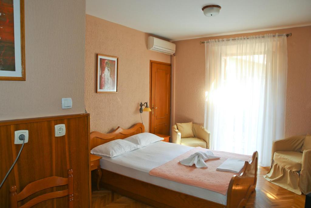 Кровать или кровати в номере Hotel Marija