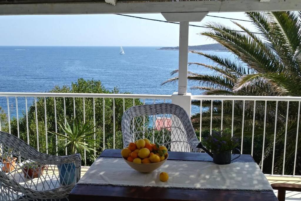 a bowl of fruit on a table on a balcony at Getaway house Gundula in Podstražje