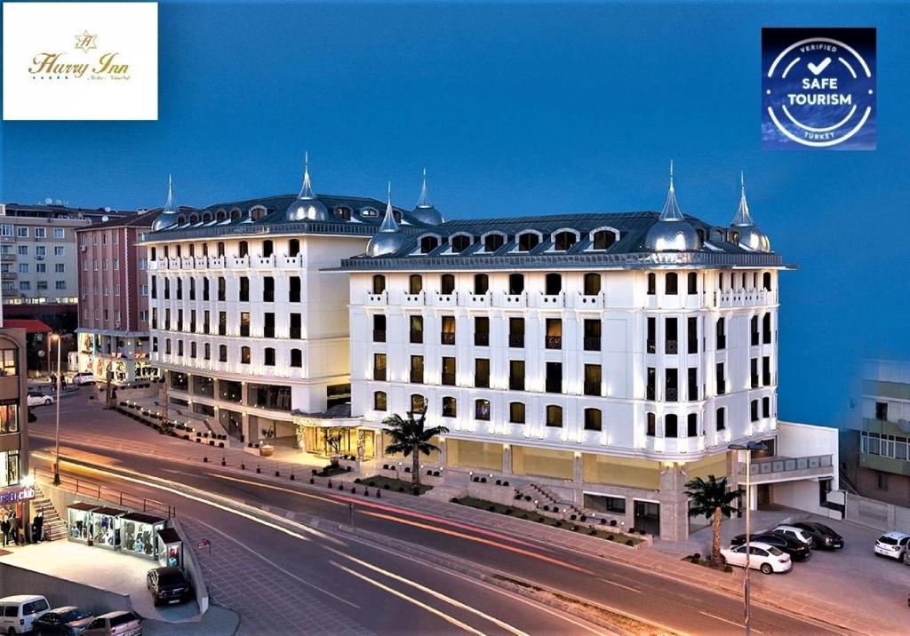 a large white building with a street in front of it at Hurry Inn Merter Istanbul in Istanbul