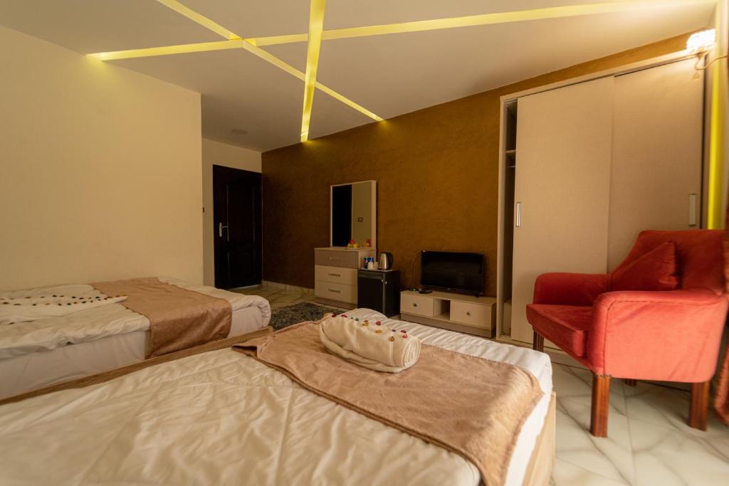 Postel nebo postele na pokoji v ubytování Gardenia Inn
