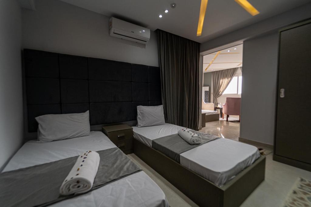 Postel nebo postele na pokoji v ubytování Gardenia Inn
