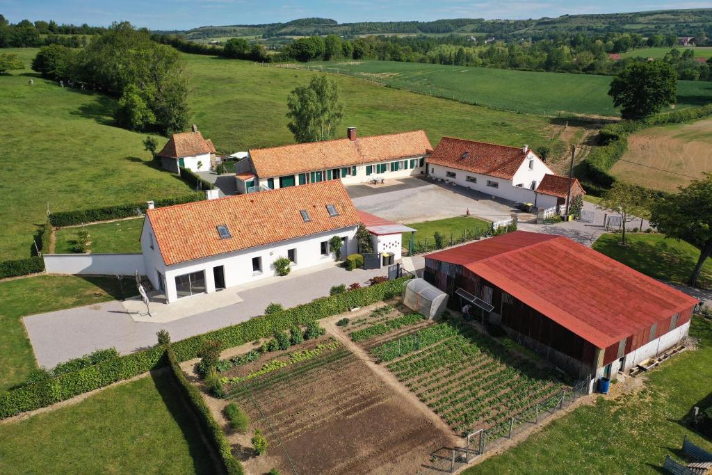 an aerial view of a large white building with a red roof at les gîtes de la cuesta in Henneveux