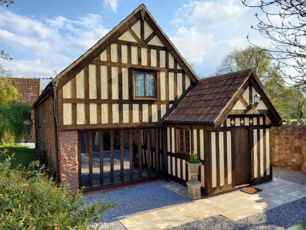 an exterior view of a barn with a large window at The Old Carthouse in Bridgwater