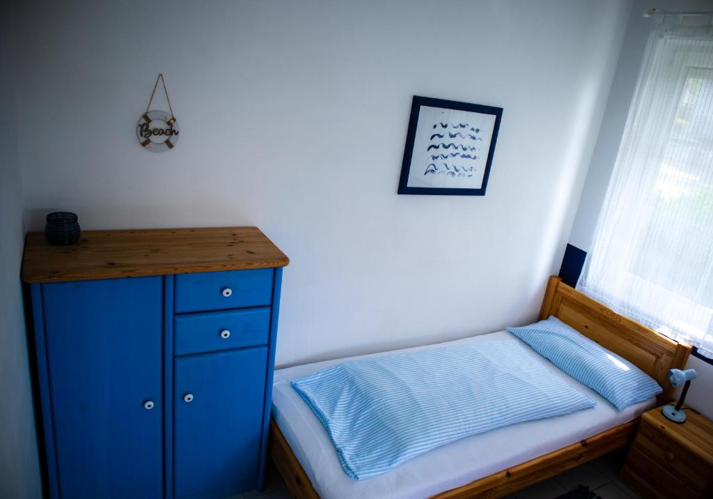 Postel nebo postele na pokoji v ubytování Nefelejcs Apartmanház