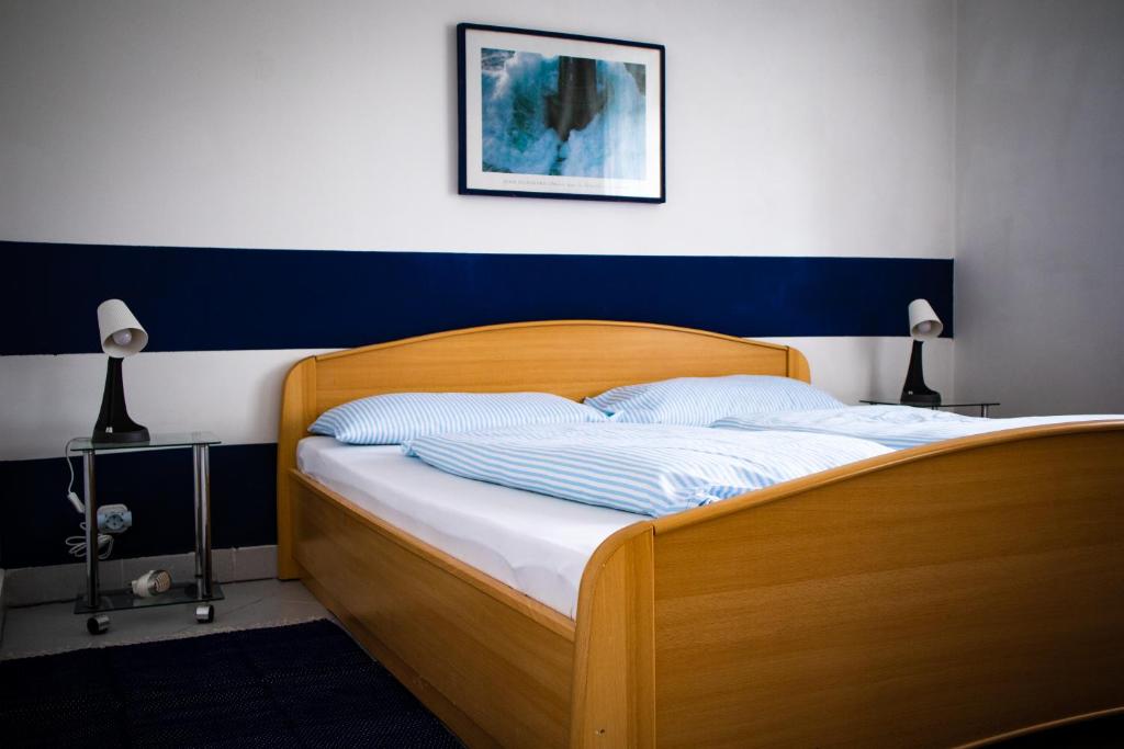 Postel nebo postele na pokoji v ubytování Nefelejcs Apartmanház