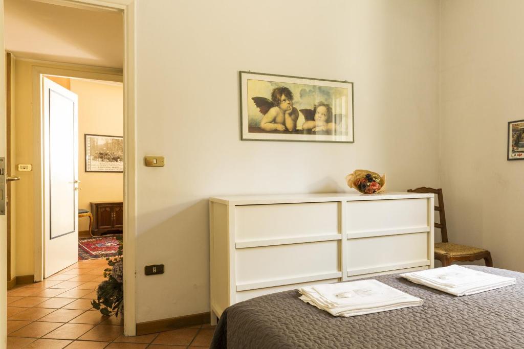 Posteľ alebo postele v izbe v ubytovaní Lemon Tree Apartment Sistine Chapel