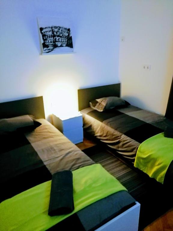 Posteľ alebo postele v izbe v ubytovaní Pula Center Arena Belvedere Apartments and Rooms