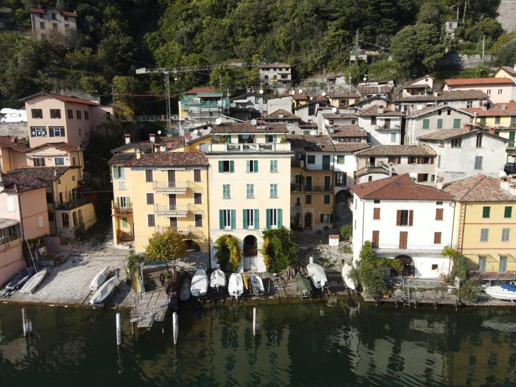 an aerial view of a town on the water at Oria Lugano Lake, il nido dell'aquila in Oria