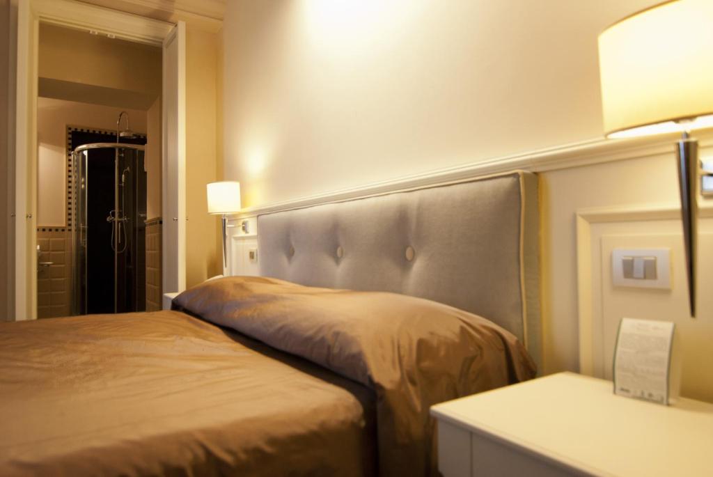 Postel nebo postele na pokoji v ubytování Hotel Patria