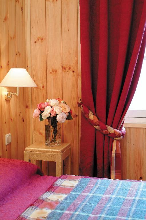 Postel nebo postele na pokoji v ubytování Hotel Le Viscos