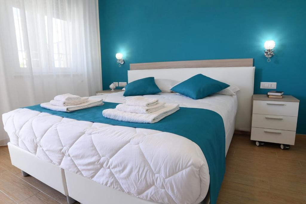 Postel nebo postele na pokoji v ubytování B&B Il FIORONE