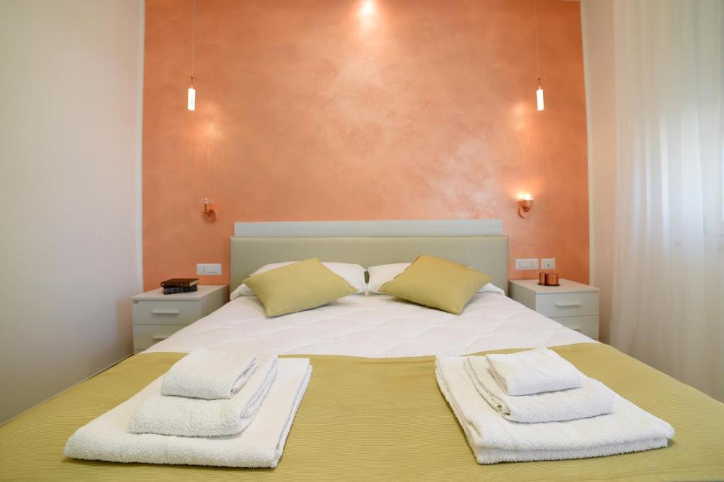 Postel nebo postele na pokoji v ubytování B&B Il FIORONE