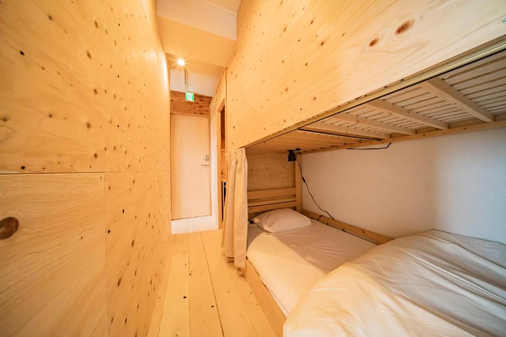 Postel nebo postele na pokoji v ubytování ArtBar & GuestHouse ennova