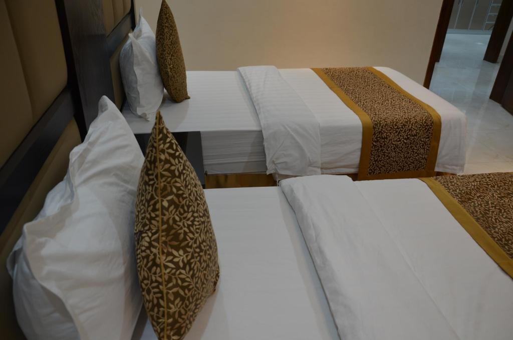 Postel nebo postele na pokoji v ubytování Alwan apartment hotel