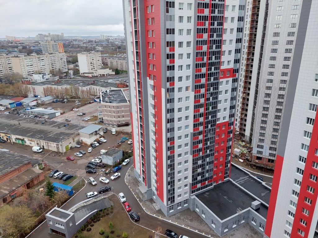 an aerial view of a tall building in a city at Top Apartments Hollywood in Kazan