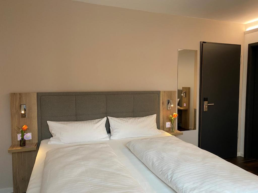 Postel nebo postele na pokoji v ubytování Hotel B4