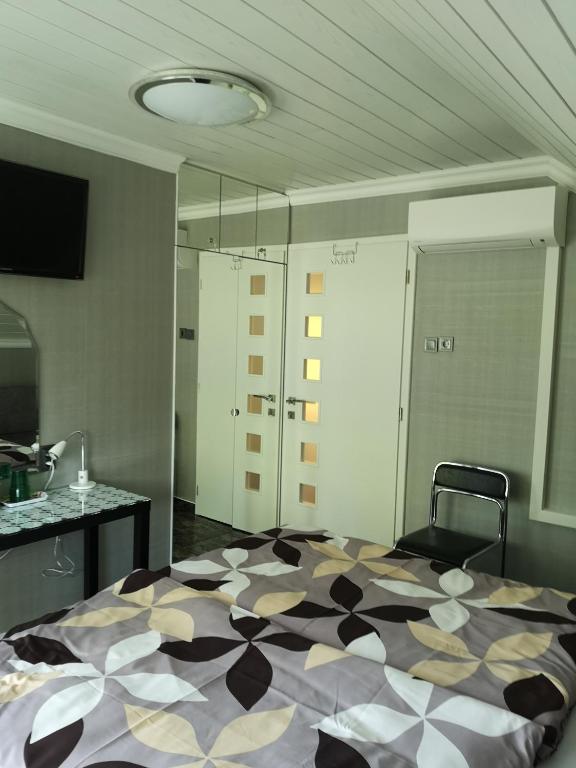 Televízia a/alebo spoločenská miestnosť v ubytovaní Lake Balaton Apartmanház