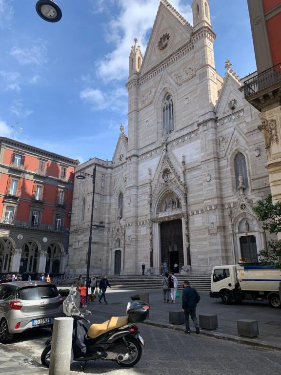 a motorcycle parked in front of a church at Napoli Centro Antico in Naples